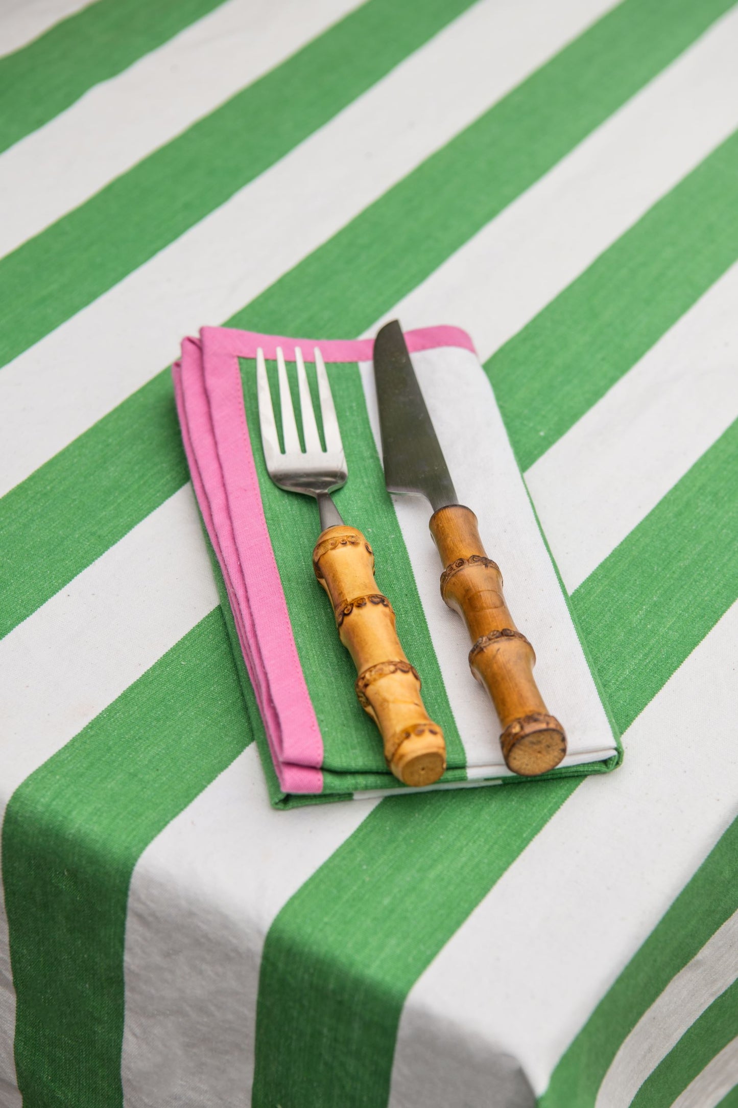 green striped napkin with pink edging