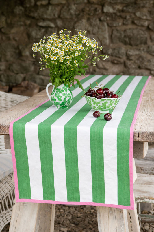 green striped table runner with pink edging