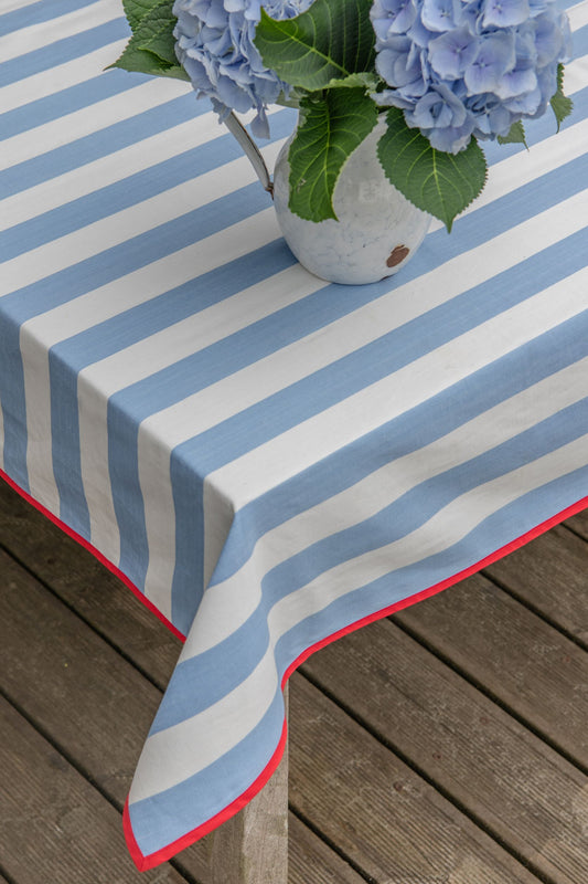 blue striped tablecloth with red edging