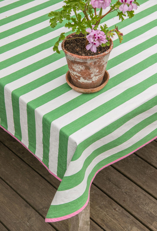 green striped tablecloth with pink edging