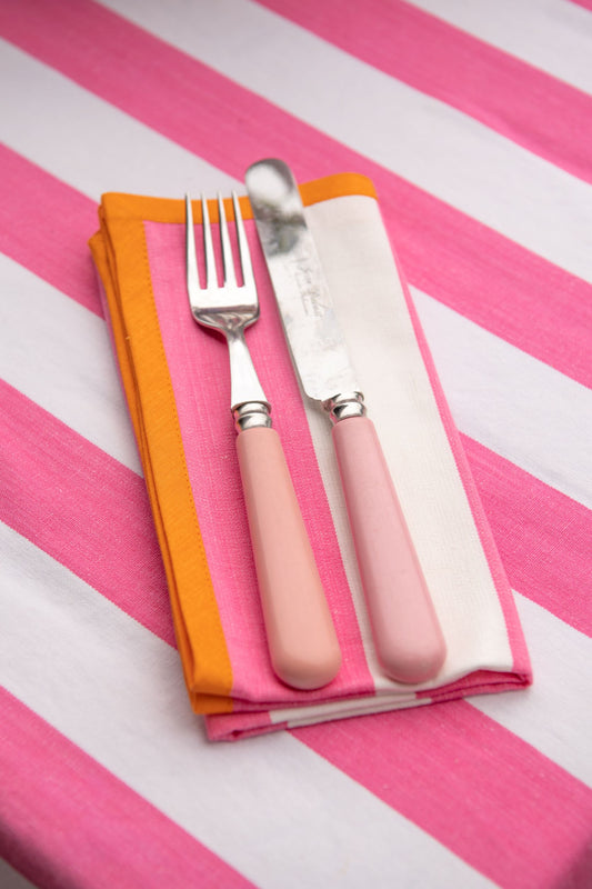 pink striped napkin with orange edging